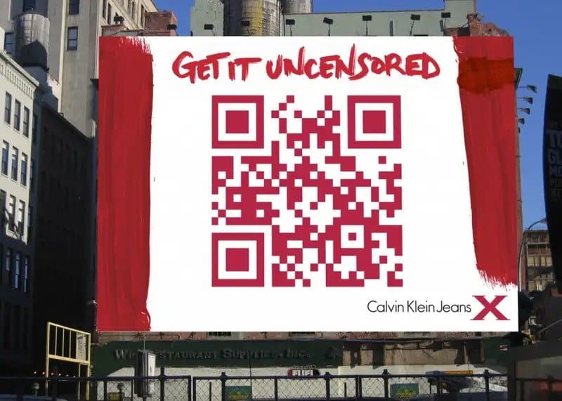 Photo of a billboard with giant red QR code.