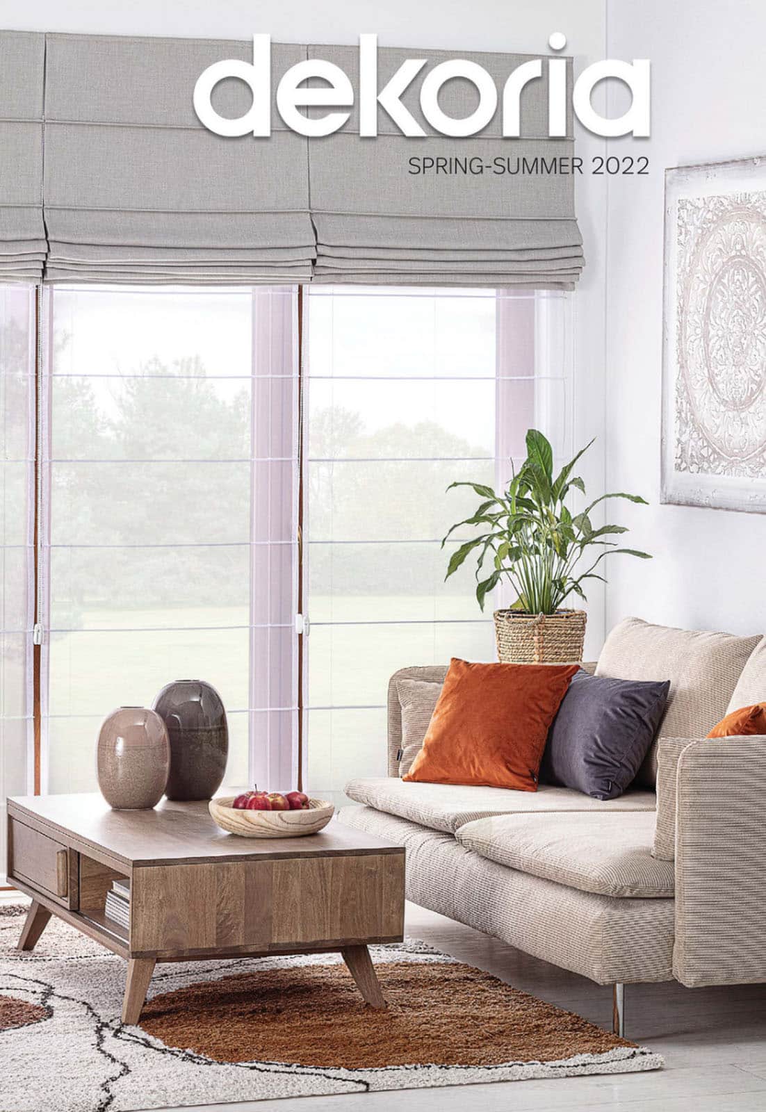 White living room with grey, orange, and light brown tints.